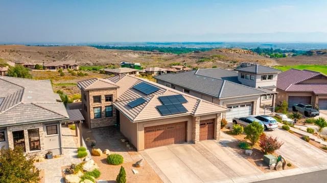 an aerial view of residential houses with outdoor space