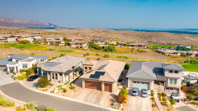 an aerial view of residential houses with outdoor space
