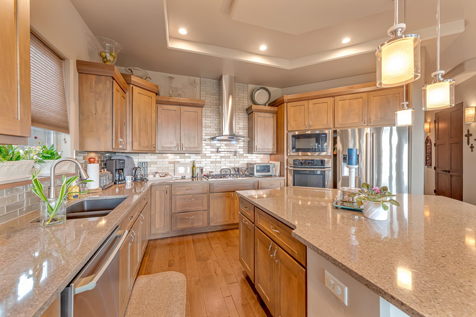 355 West Ridges Boulevard Grand Junction, CO 81507 - Photo 8 of 42 a kitchen with granite countertop a sink a counter top space appliances and cabinets