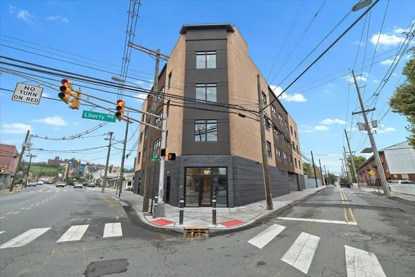 a view of a building with a street