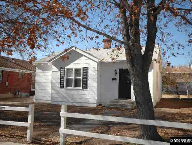 1349 Locust Street Reno, NV 89502 - Photo 1 of 9 a front view of a house with a tree