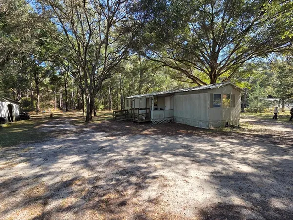 a view of outdoor space with deck and tree