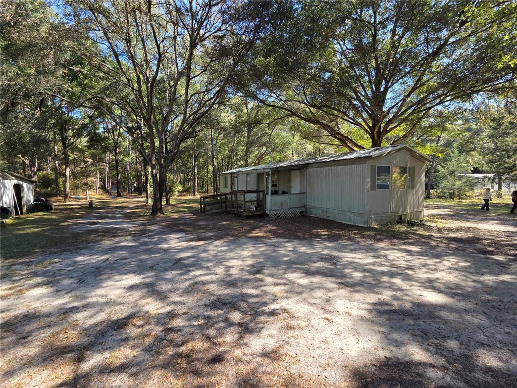 a view of outdoor space with deck and tree