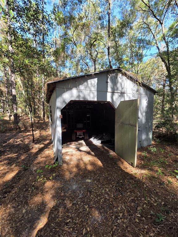 114 Lemon Street Melrose, FL 32666 - Photo 14 of 17 a view of a wooden door of a house