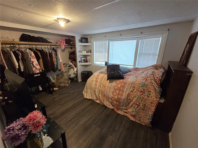 a bed room with a bed and a window