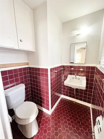 a bathroom with a toilet and a sink