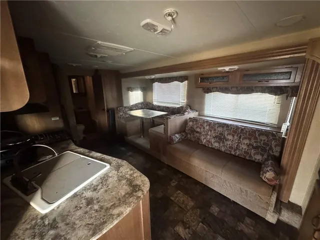 a bed sitting in a room next to a window