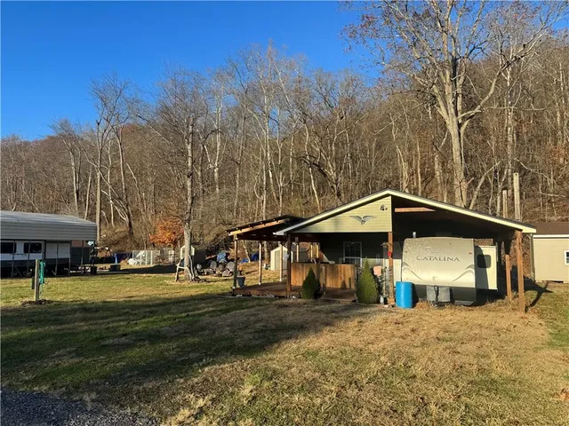 a view of a park with large trees