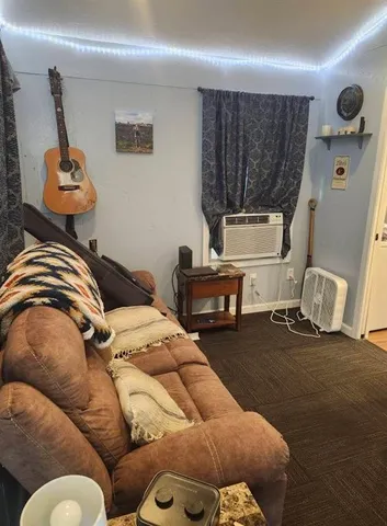 a bedroom with a bed and couch