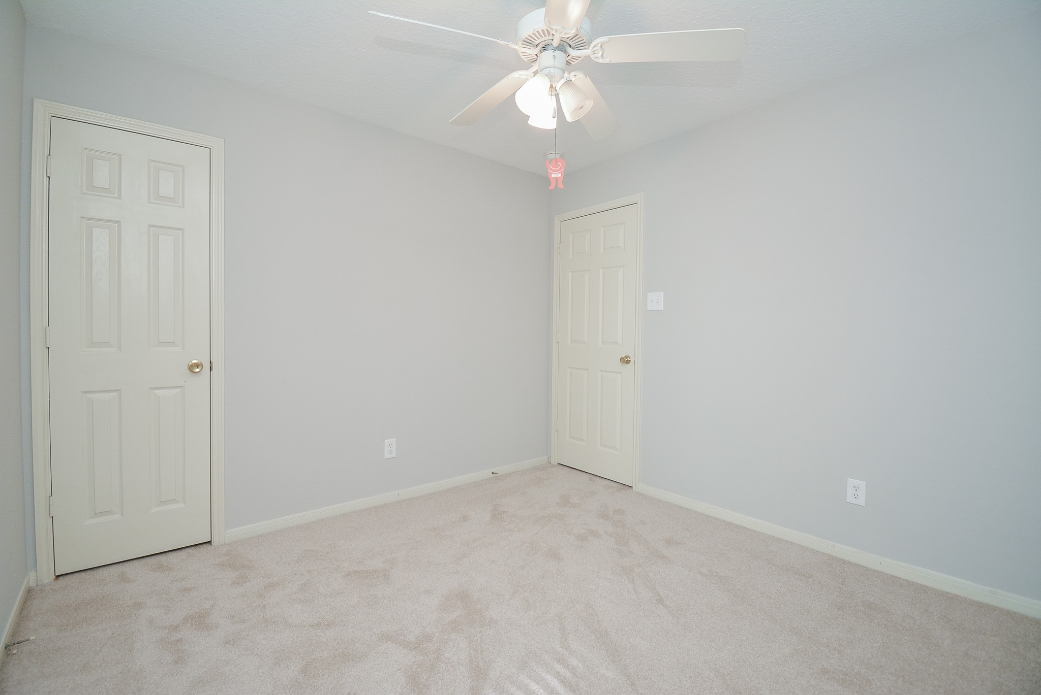 18714 Flagstone Creek Road Houston, TX 77084 - Photo 12 of 50 a view of an empty room with a fan