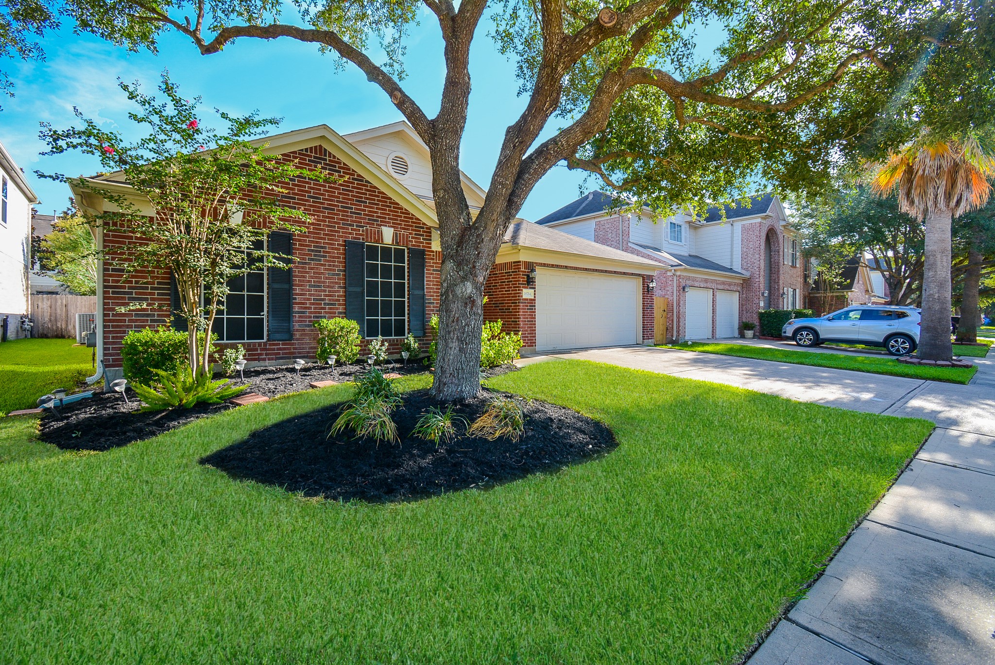 18714 Flagstone Creek Road Houston, TX 77084 - Photo 2 of 50 a front view of a house with garden