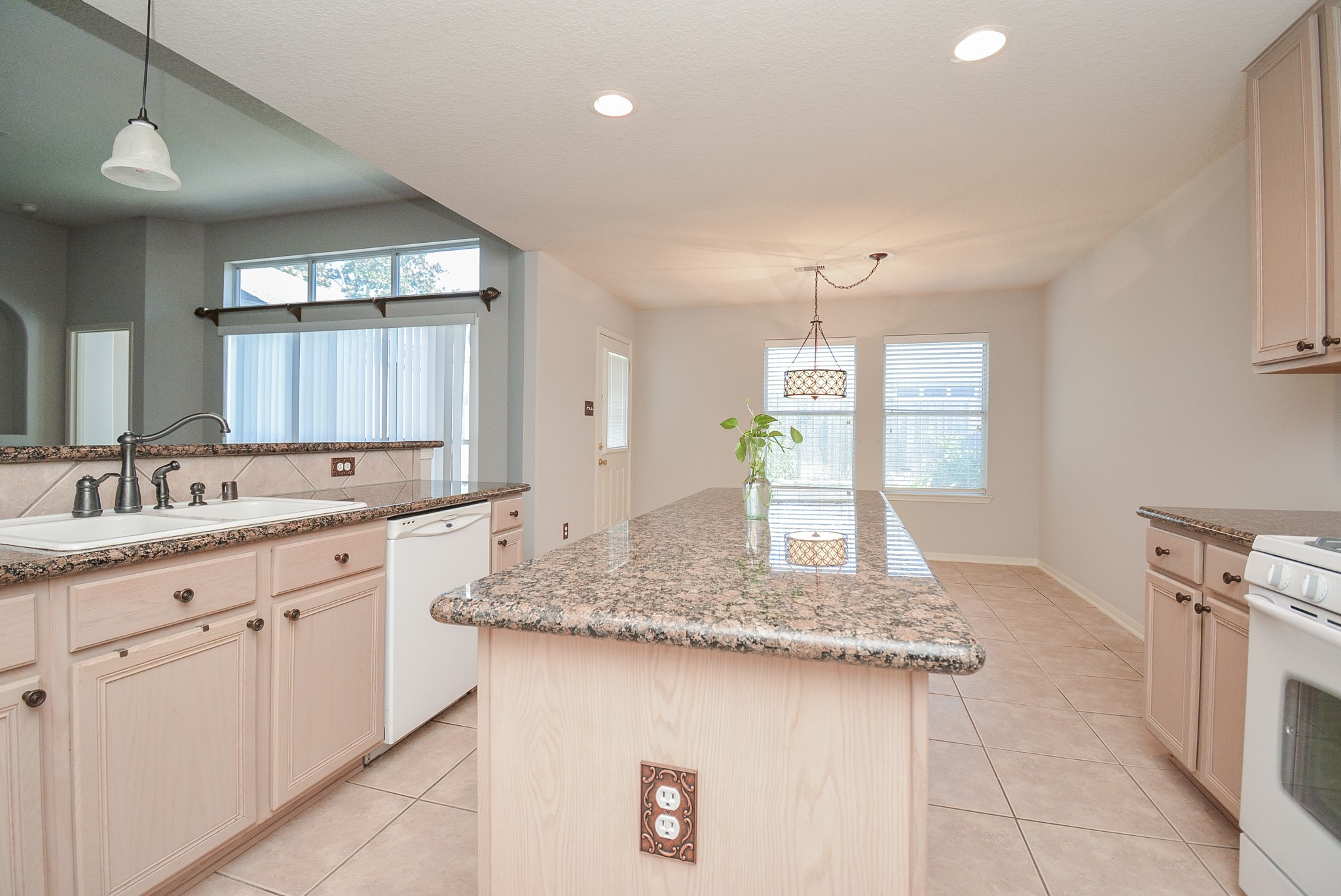 18714 Flagstone Creek Road Houston, TX 77084 - Photo 32 of 50 a bathroom with a granite countertop sink and a mirror