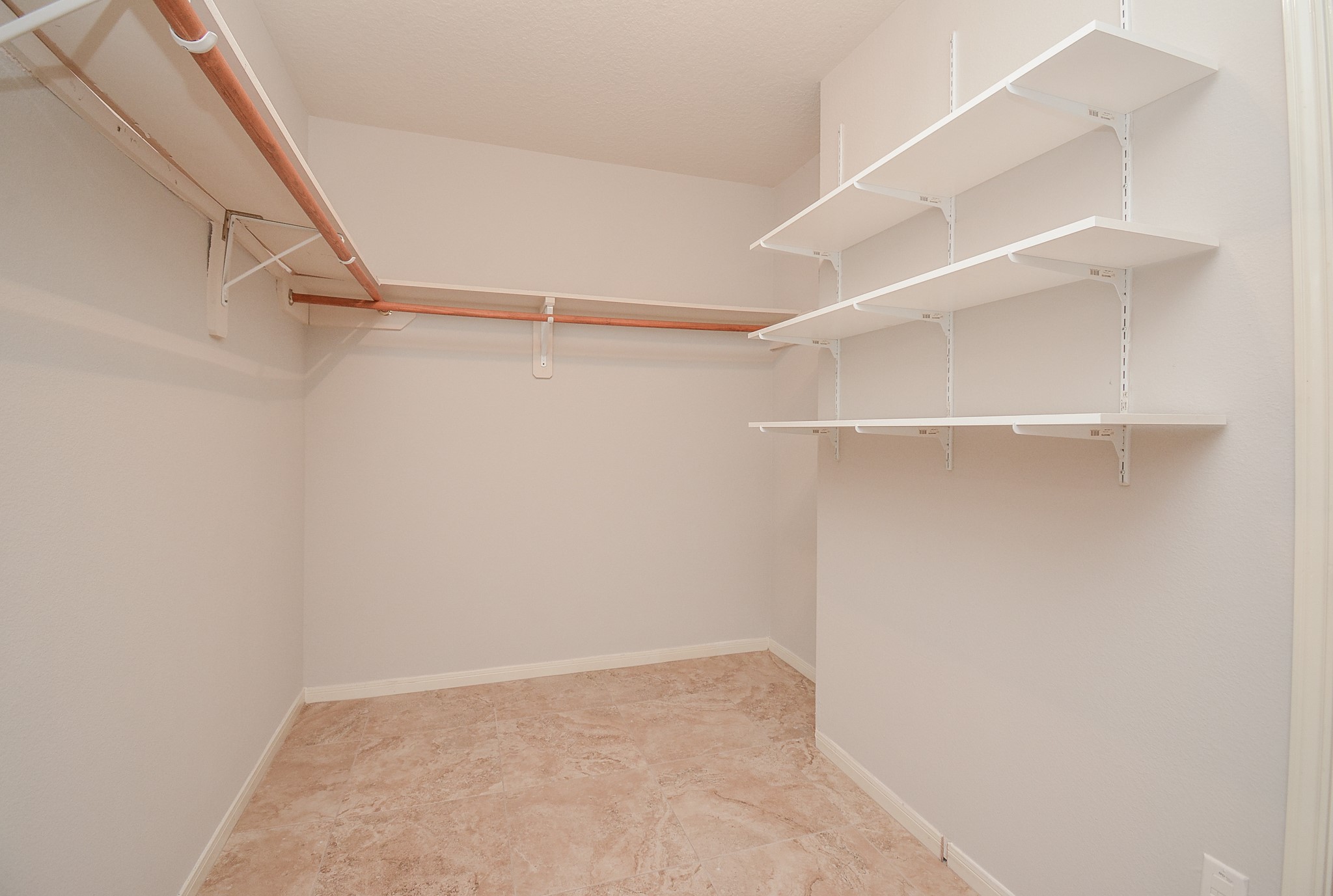 18714 Flagstone Creek Road Houston, TX 77084 - Photo 40 of 50 a view of an empty walk in closet