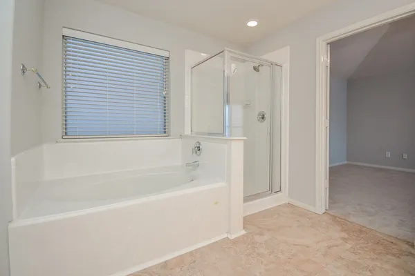 a bathroom with a sink a mirror and a shower