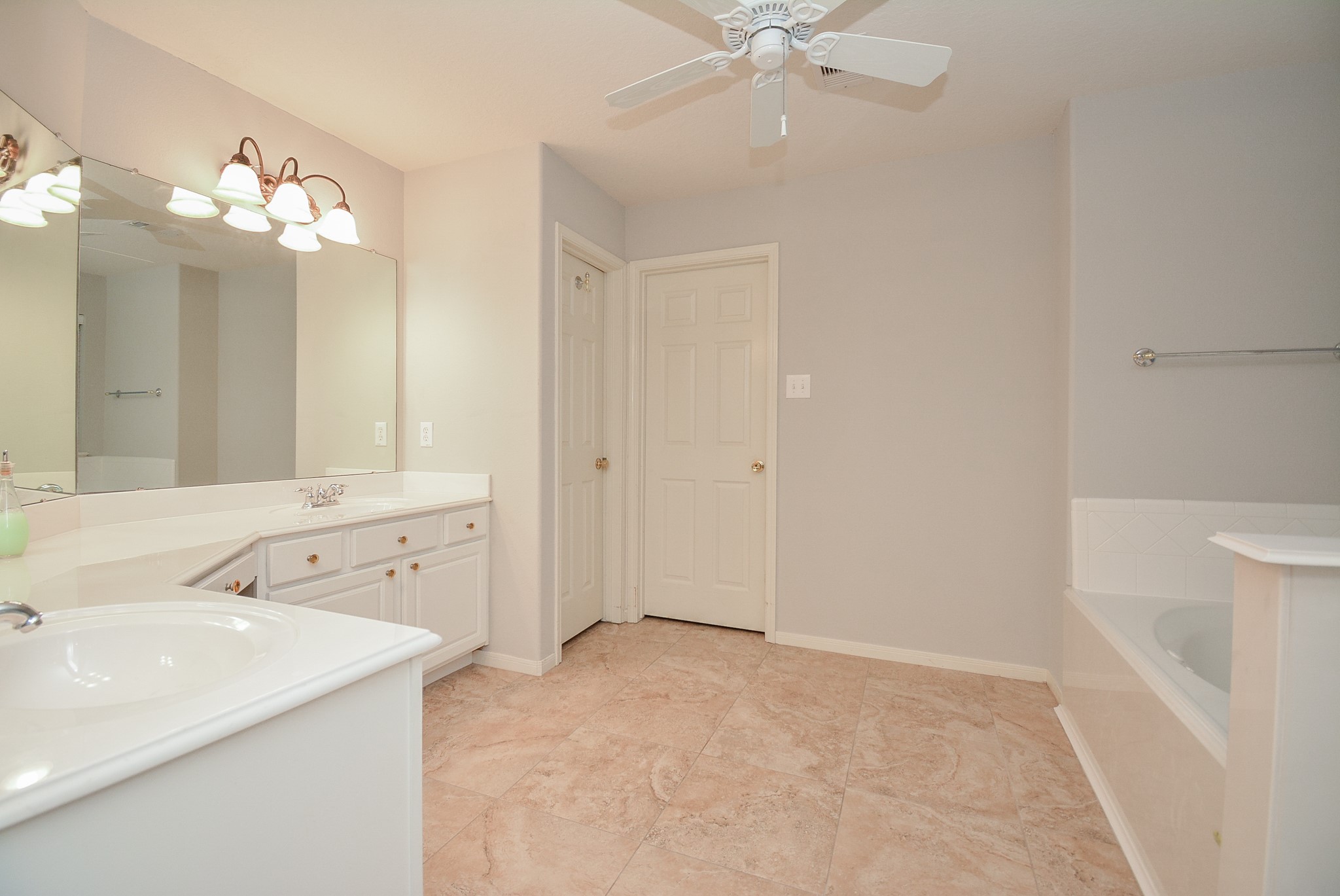 18714 Flagstone Creek Road Houston, TX 77084 - Photo 43 of 50 a bathroom with a sink a mirror and a shower