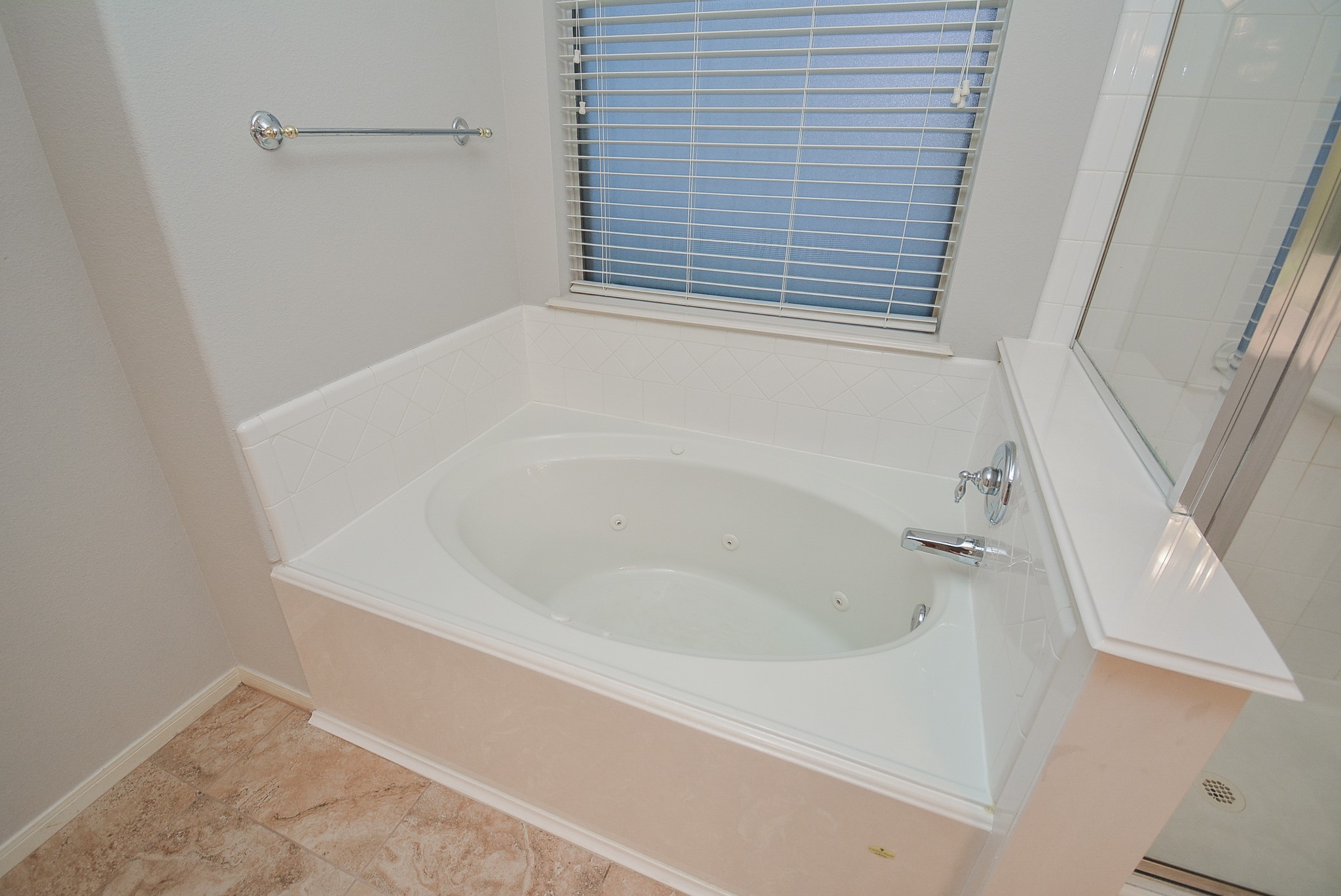 18714 Flagstone Creek Road Houston, TX 77084 - Photo 44 of 50 a white bath tub sitting next to a window