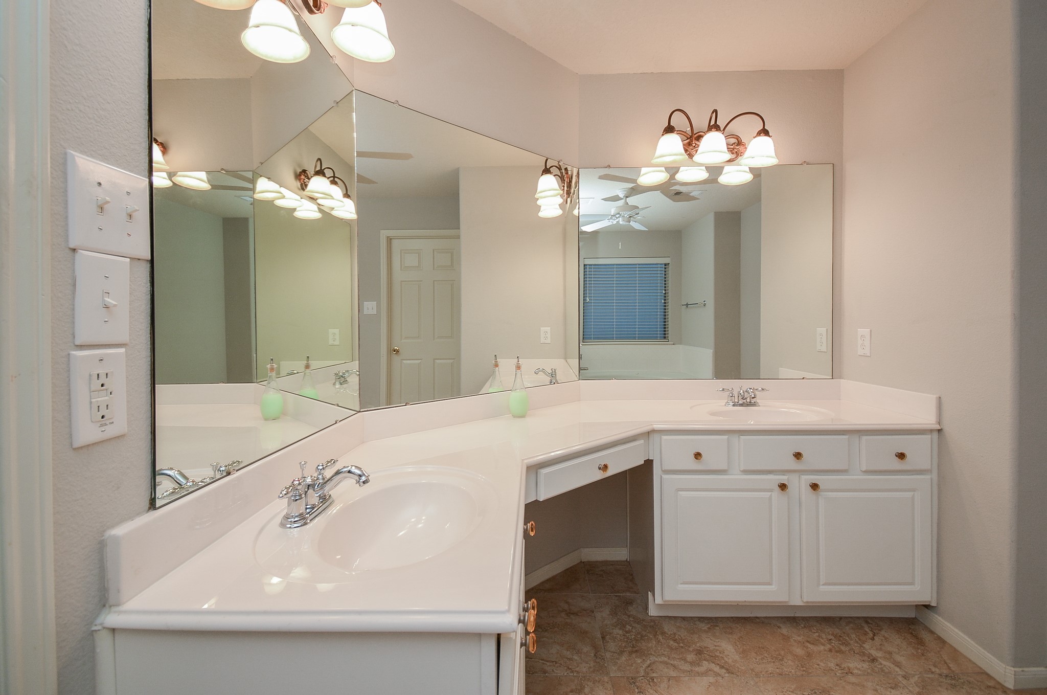 18714 Flagstone Creek Road Houston, TX 77084 - Photo 46 of 50 a bathroom with a sink vanity and a mirror