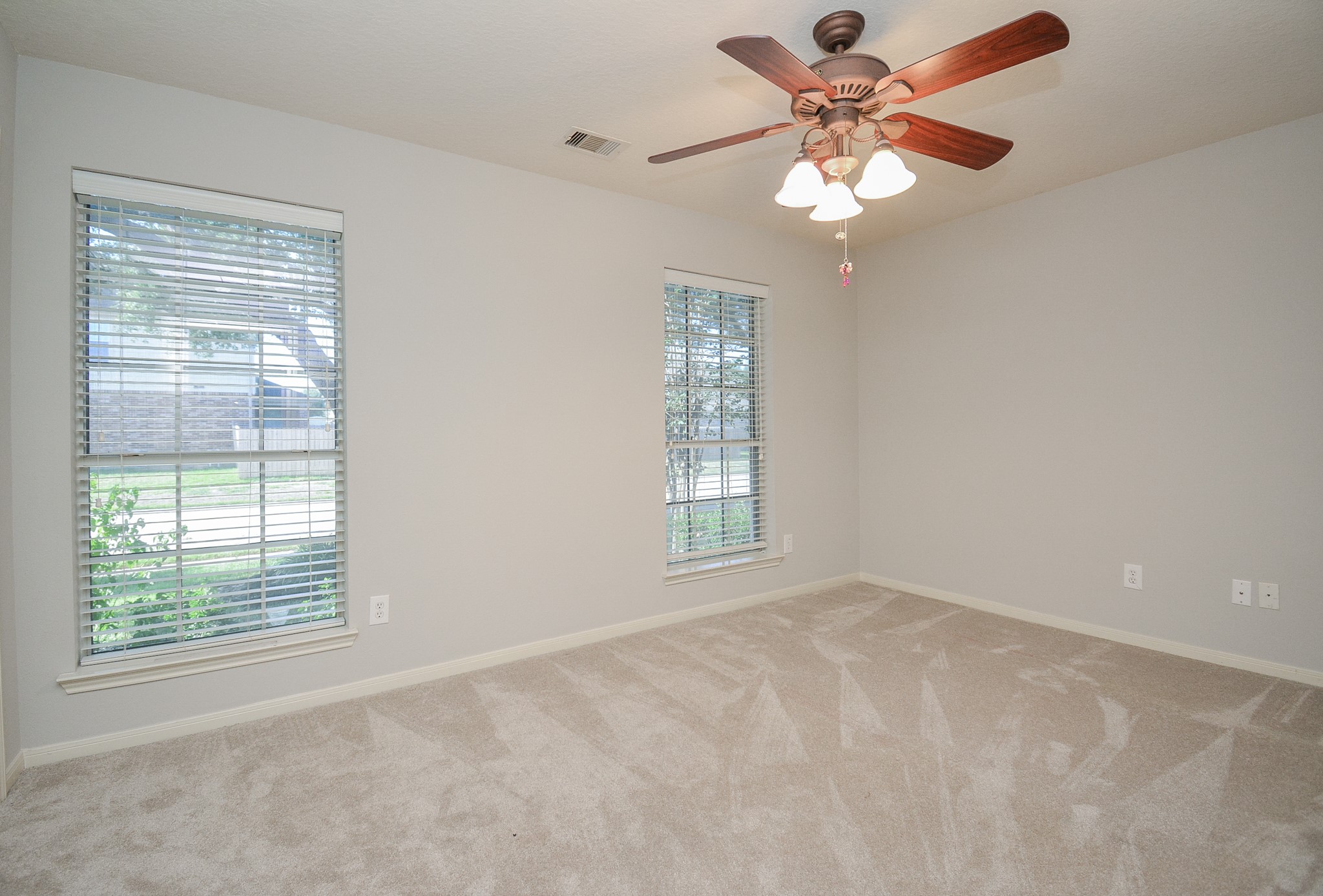 18714 Flagstone Creek Road Houston, TX 77084 - Photo 7 of 50 a view of an empty room with a window