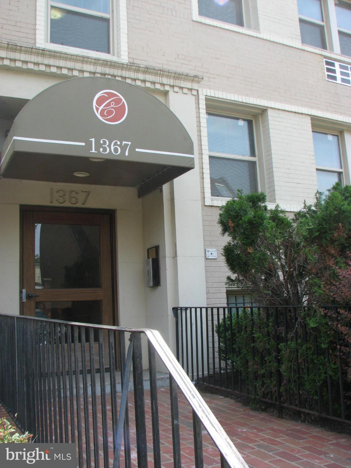 1367 K Street Southeast, Unit 101 Washington, DC 20003 - Photo 1 of 14 a view of a street sign on a house