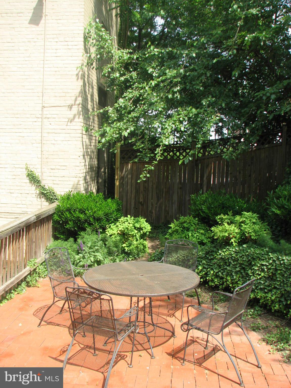1367 K Street Southeast, Unit 101 Washington, DC 20003 - Photo 14 of 14 a view of backyard with plants and outdoor seating