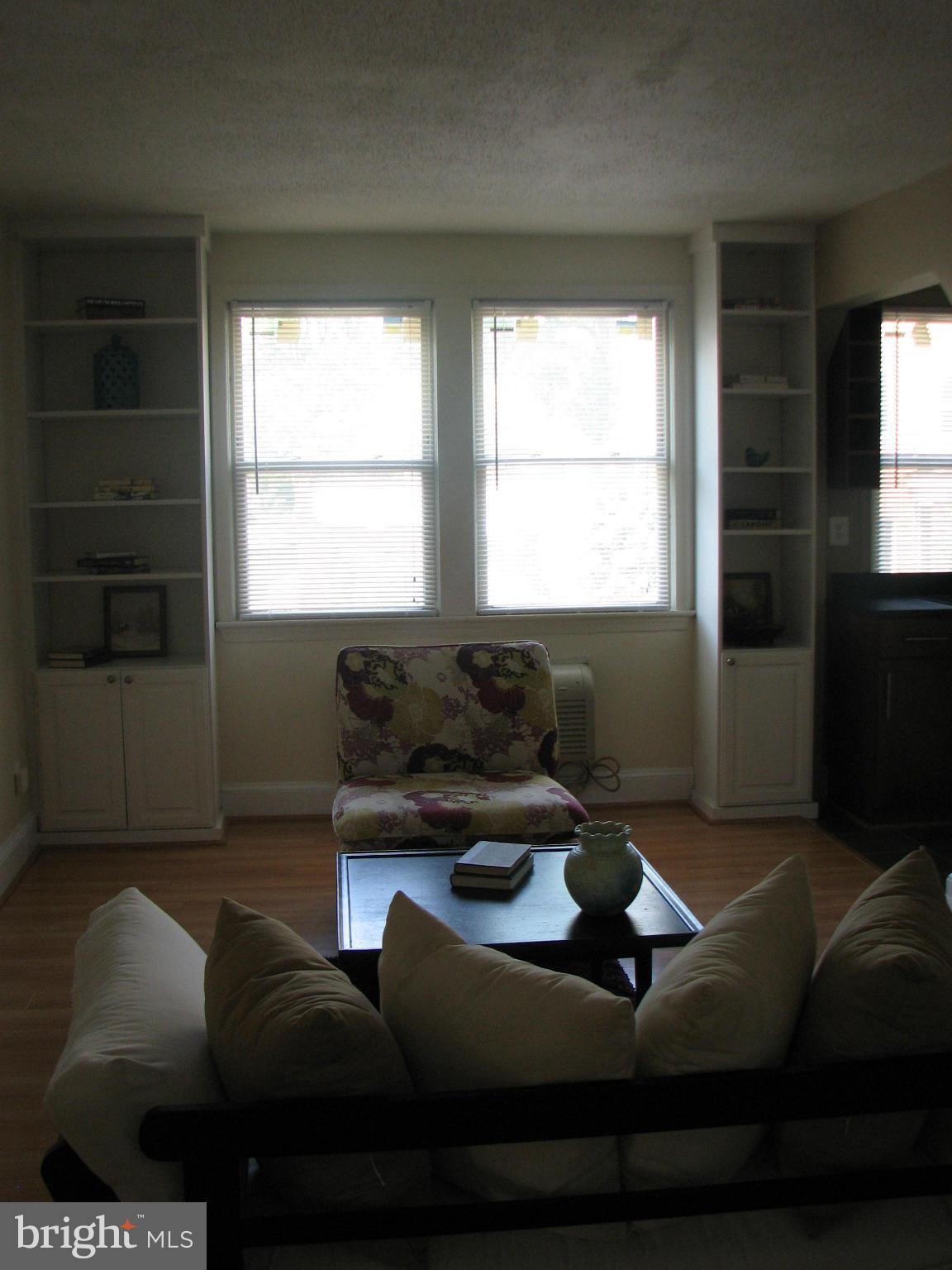 1367 K Street Southeast, Unit 101 Washington, DC 20003 - Photo 3 of 14 a living room with furniture and a flat screen tv