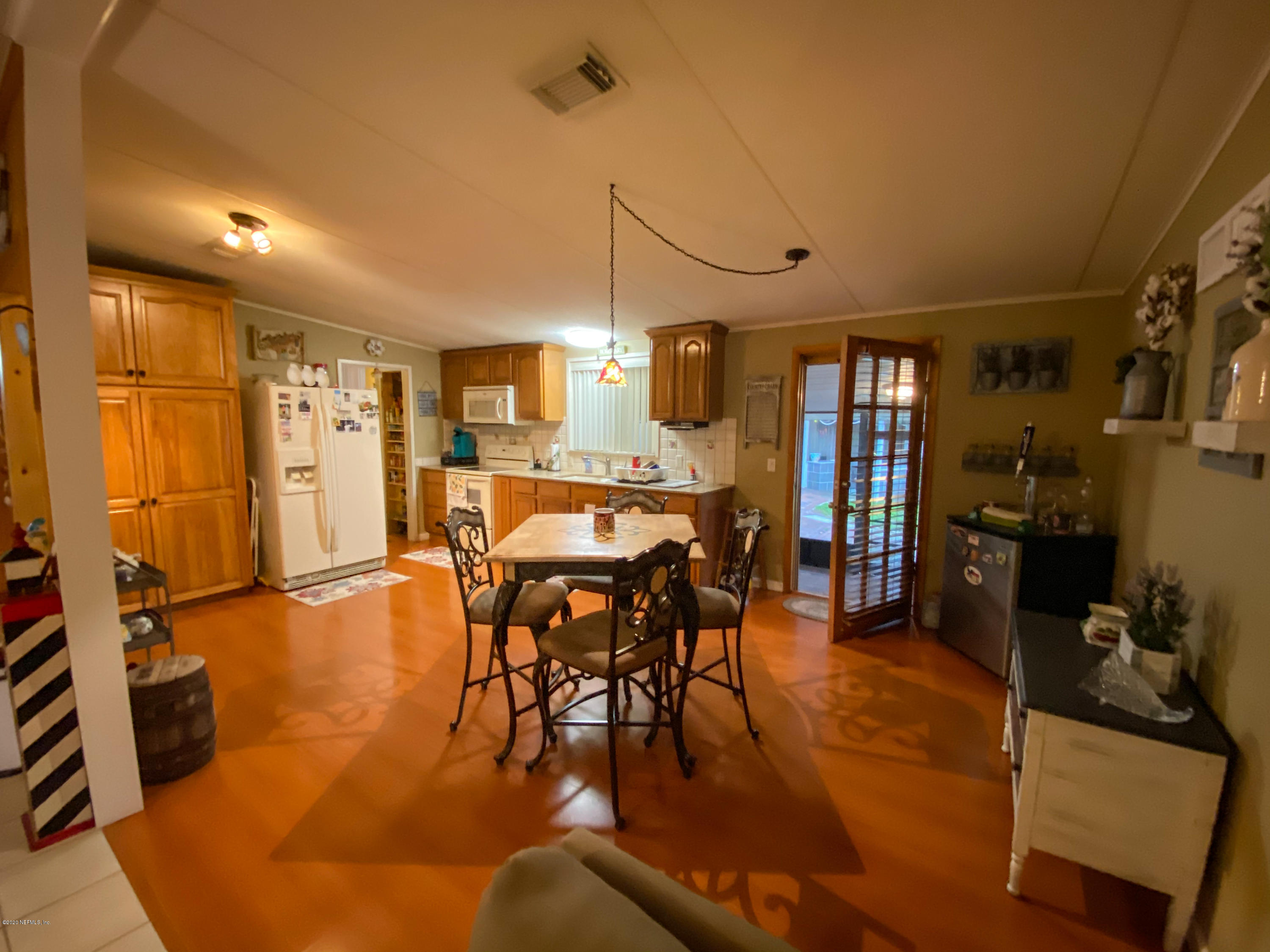86116 Pages Dairy Road Yulee, FL 32097 - Photo 12 of 46 a view of a dining room with furniture