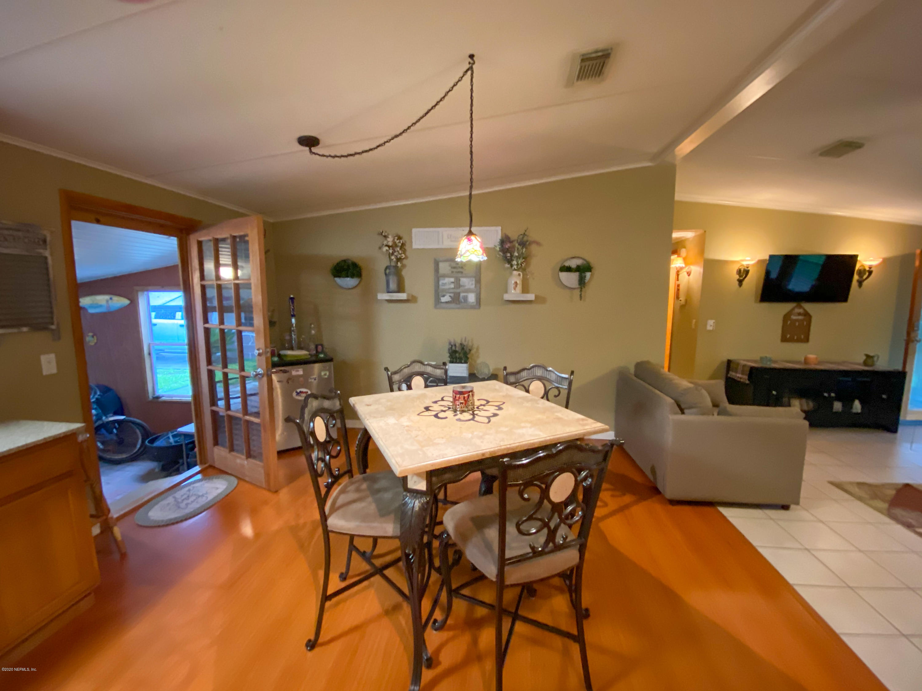 86116 Pages Dairy Road Yulee, FL 32097 - Photo 13 of 46 a view of a dining room with furniture