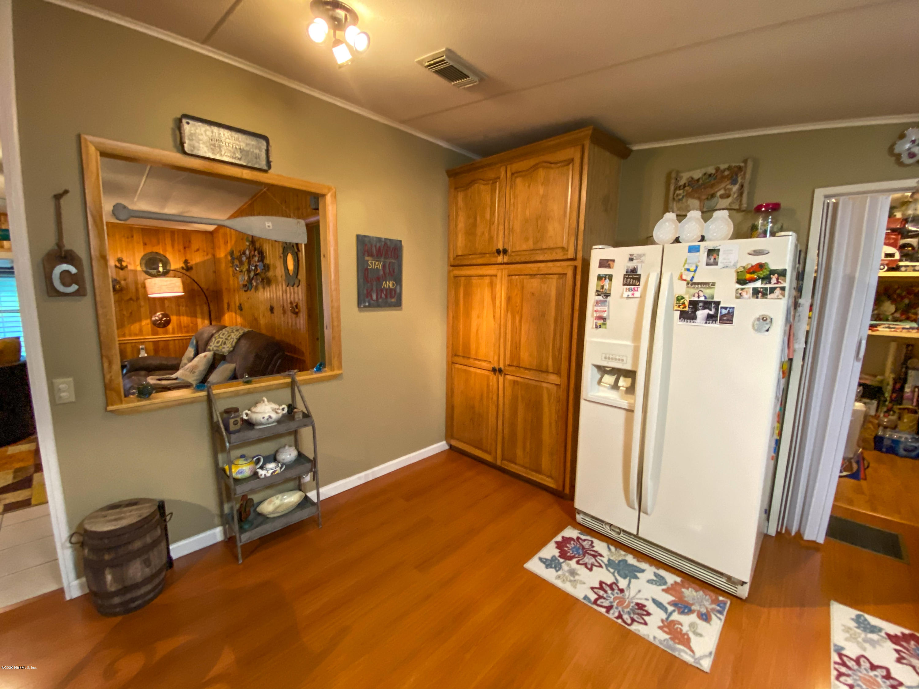 86116 Pages Dairy Road Yulee, FL 32097 - Photo 16 of 46 a view of room with window and refrigerator