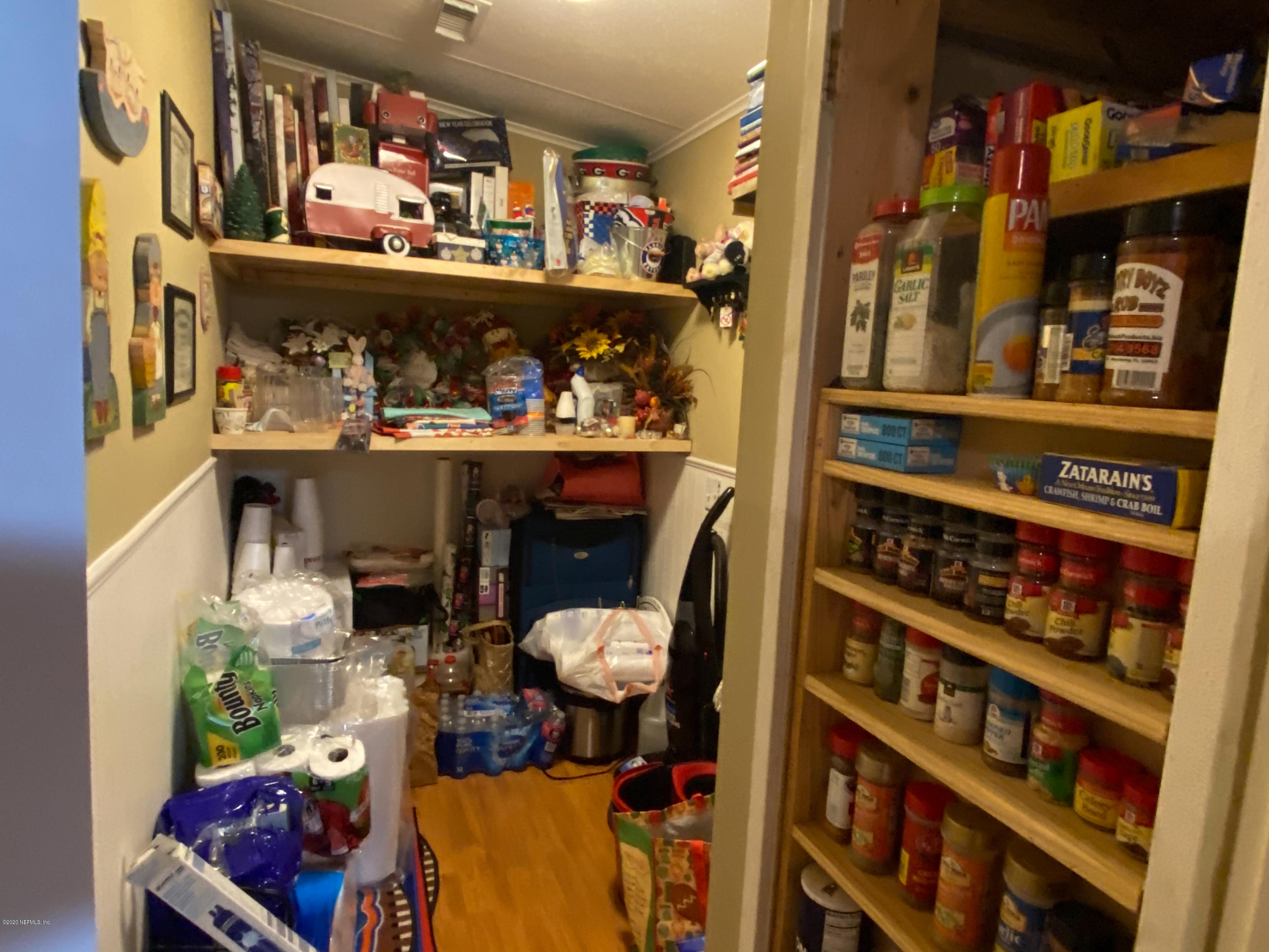 86116 Pages Dairy Road Yulee, FL 32097 - Photo 17 of 46 a room with lots of books and a large window