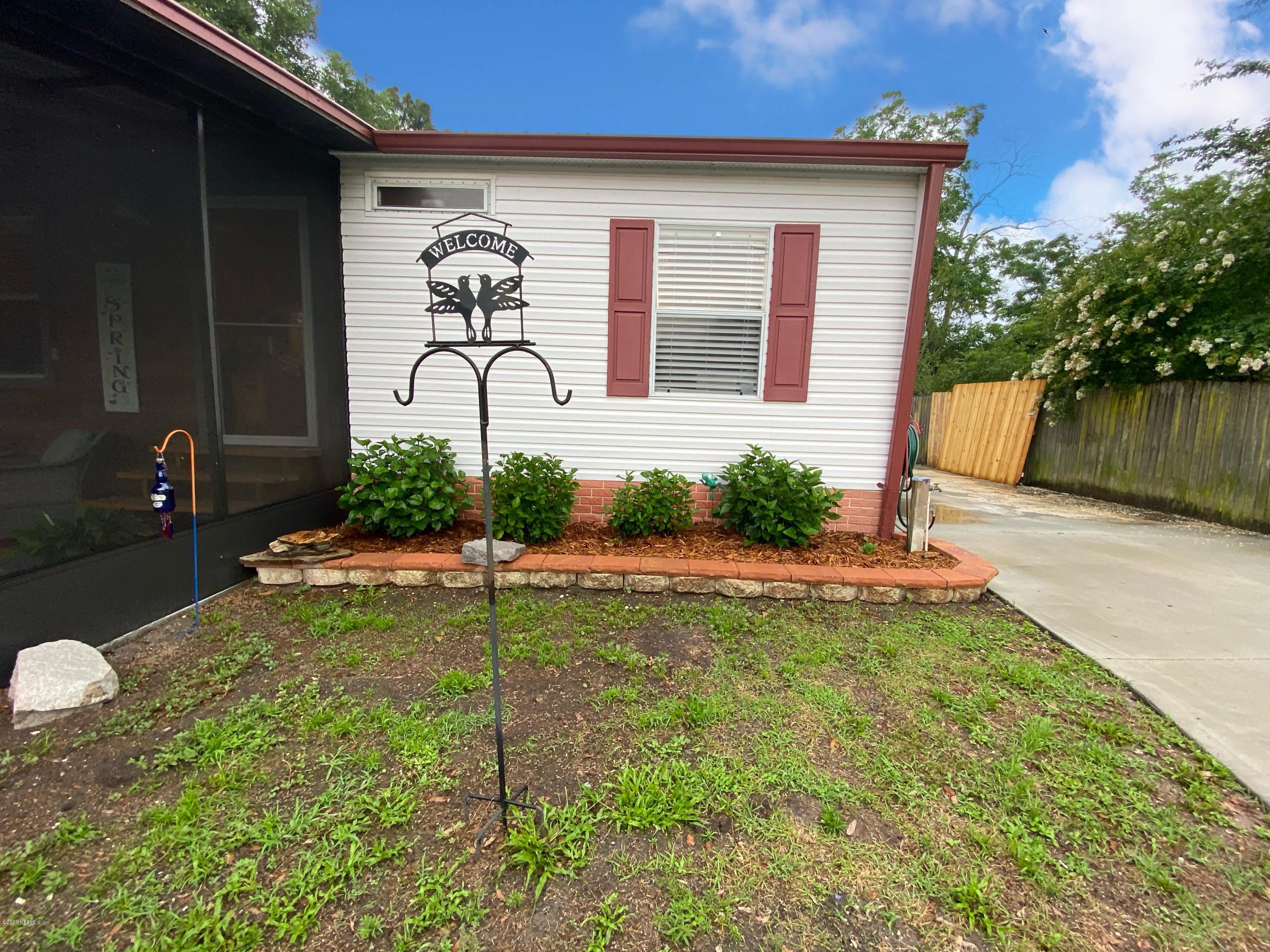 86116 Pages Dairy Road Yulee, FL 32097 - Photo 2 of 46 a house view with a garden space