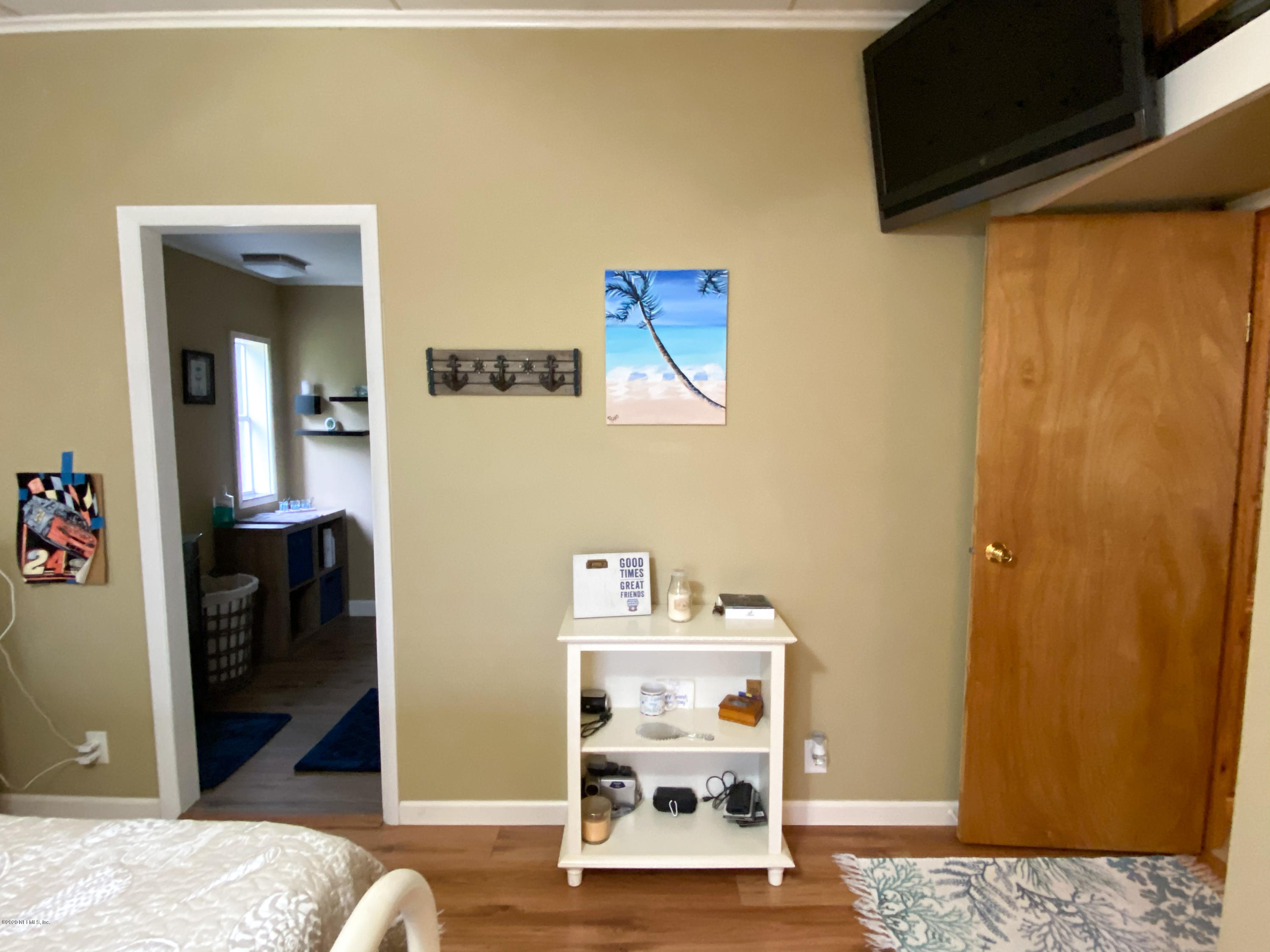 86116 Pages Dairy Road Yulee, FL 32097 - Photo 30 of 46 a view of a bedroom from a hallway