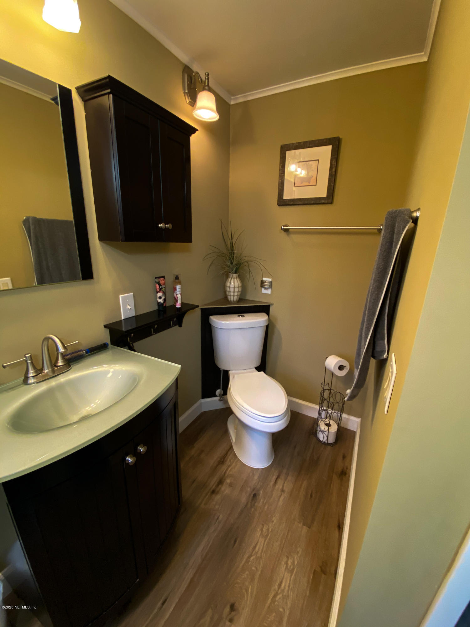 86116 Pages Dairy Road Yulee, FL 32097 - Photo 33 of 46 a bathroom with a sink and a mirror