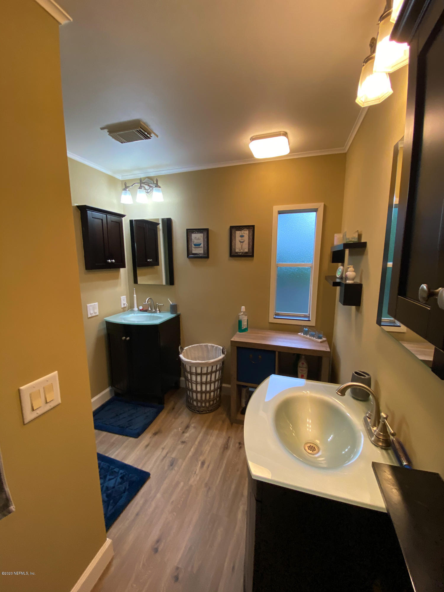 86116 Pages Dairy Road Yulee, FL 32097 - Photo 34 of 46 a bathroom with a sink double vanity granite and a mirror