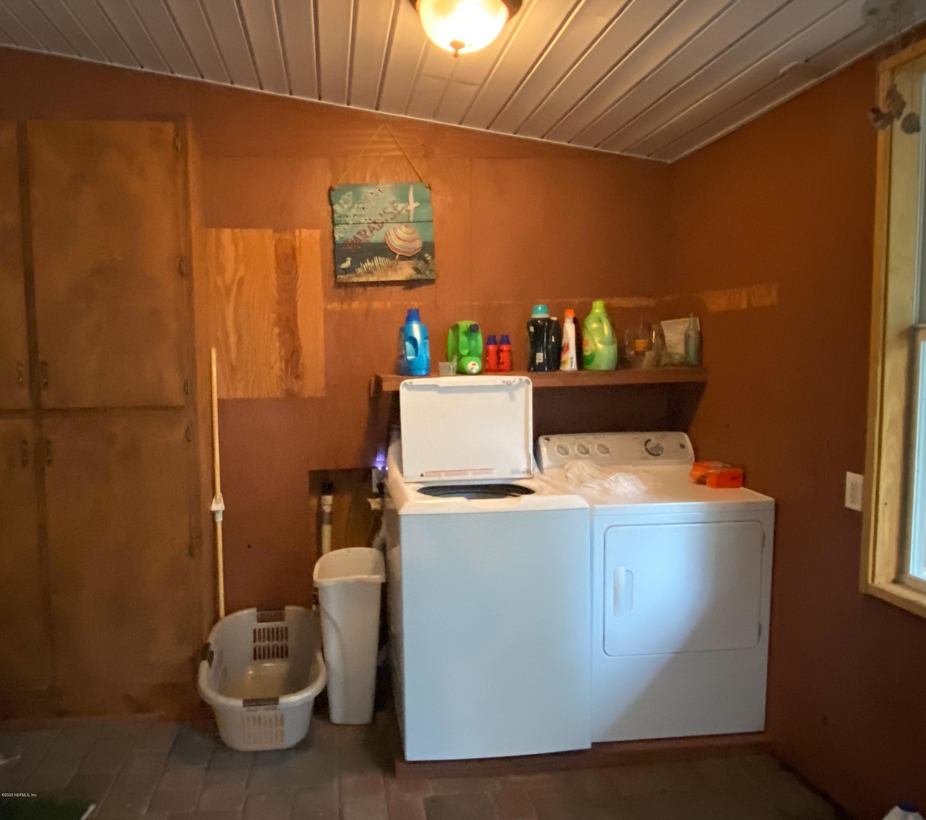 86116 Pages Dairy Road Yulee, FL 32097 - Photo 37 of 46 a room with a refrigerator and a stove