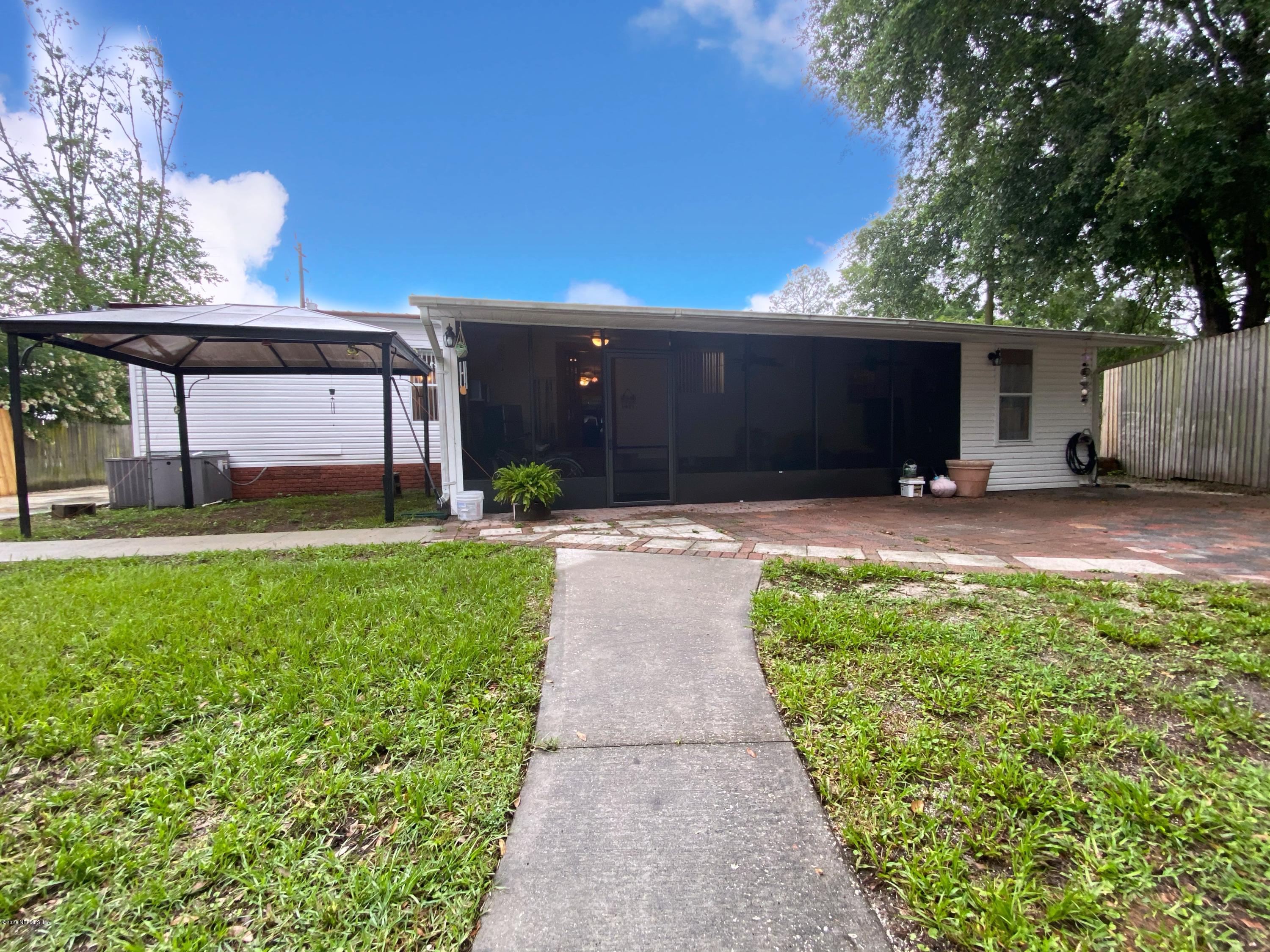 86116 Pages Dairy Road Yulee, FL 32097 - Photo 38 of 46 a house view with a garden space