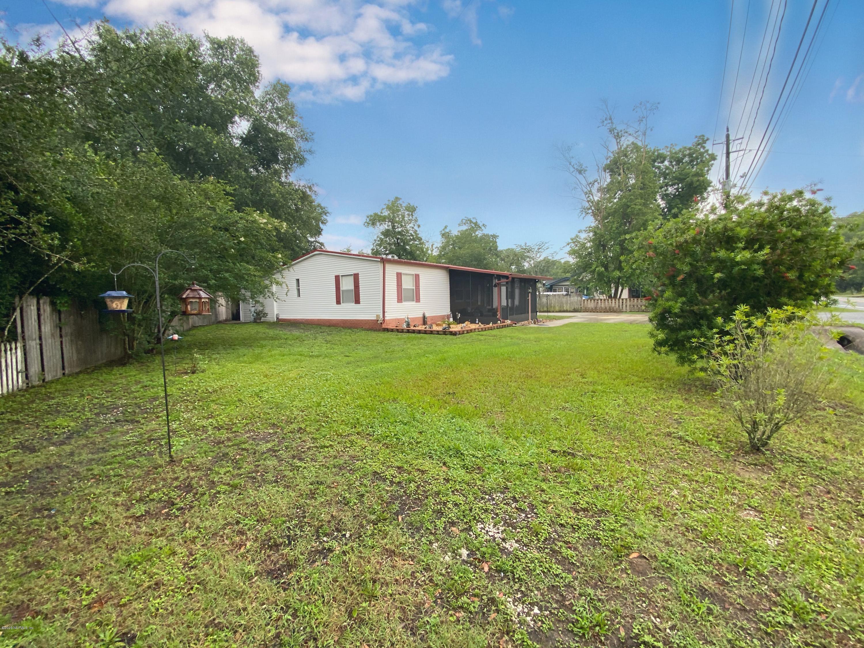 86116 Pages Dairy Road Yulee, FL 32097 - Photo 4 of 46 a view of a house with a yard
