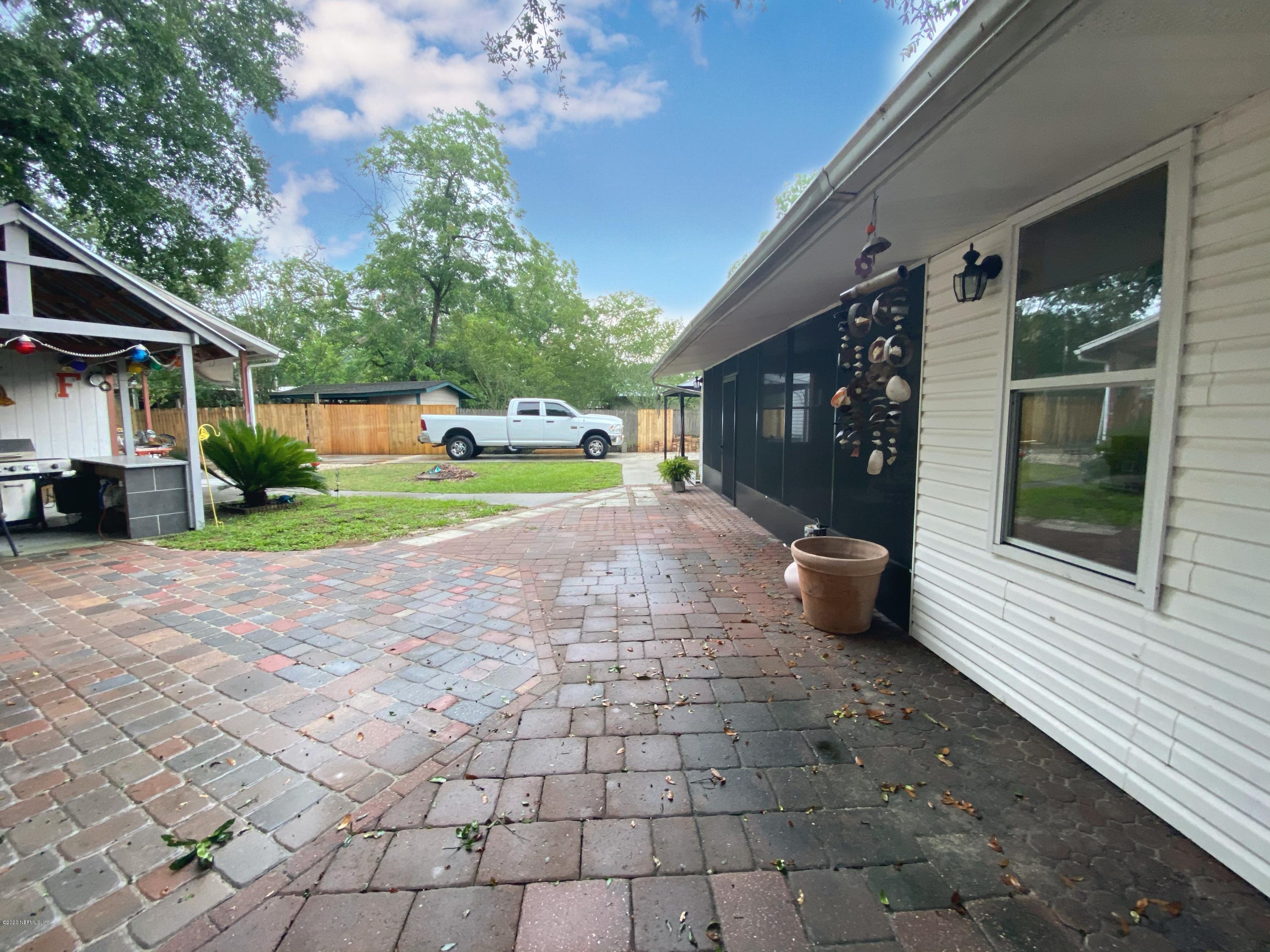 86116 Pages Dairy Road Yulee, FL 32097 - Photo 43 of 46 a view of a house with a yard and porch