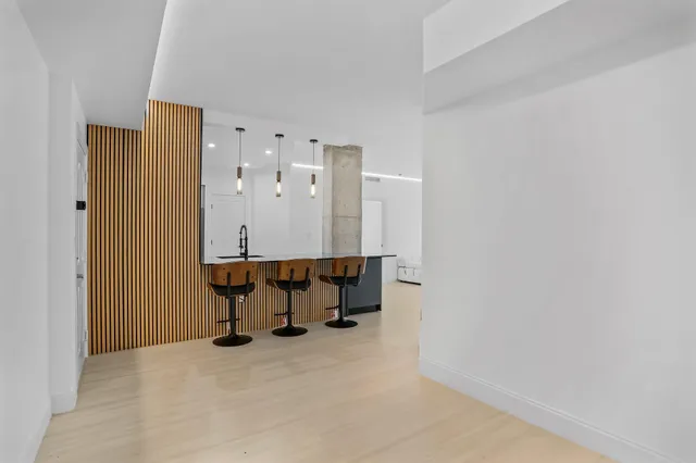 an empty room with large windows