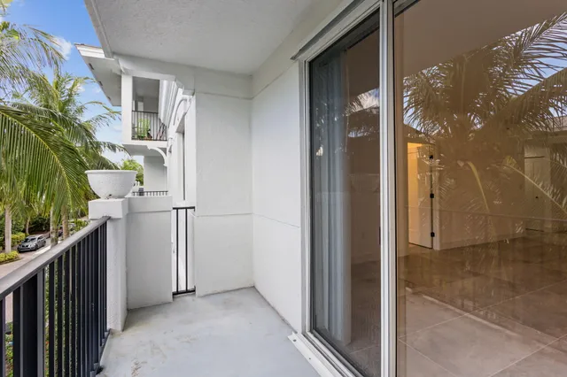 a view of balcony and small yard