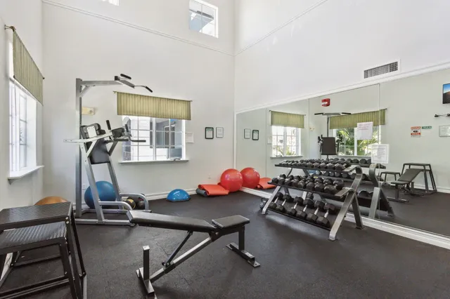 a living room with furniture a table and chairs