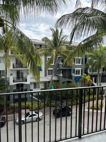 a couple of palm trees in front of house