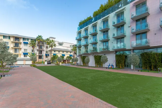 a view of a house with swimming pool and a porch