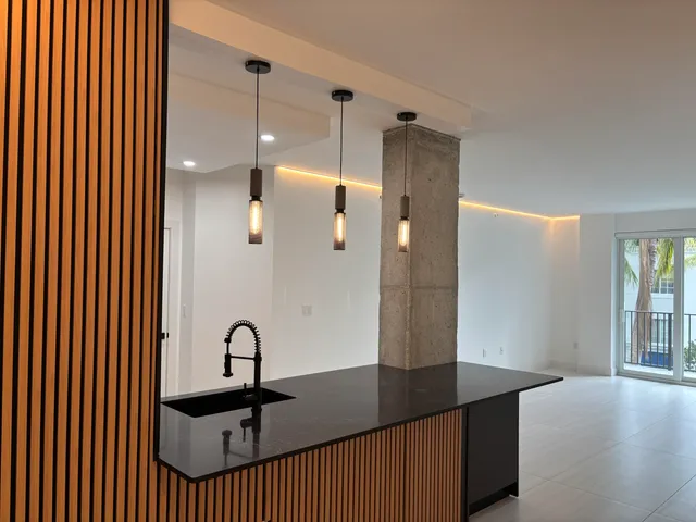a picture of a bathroom with sink and mirror