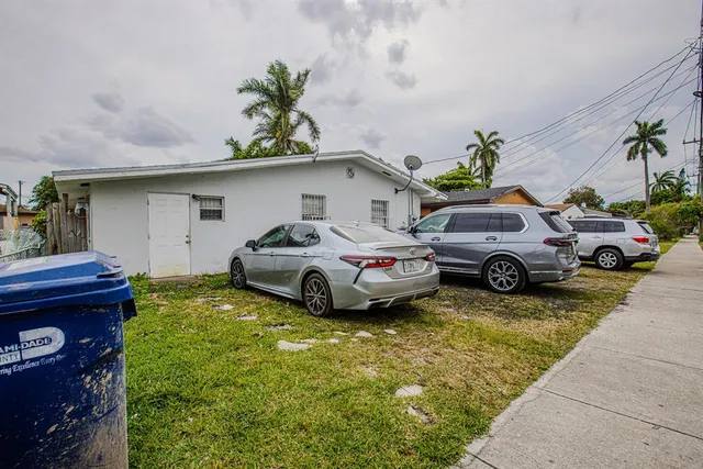 a cars parked in front of a house