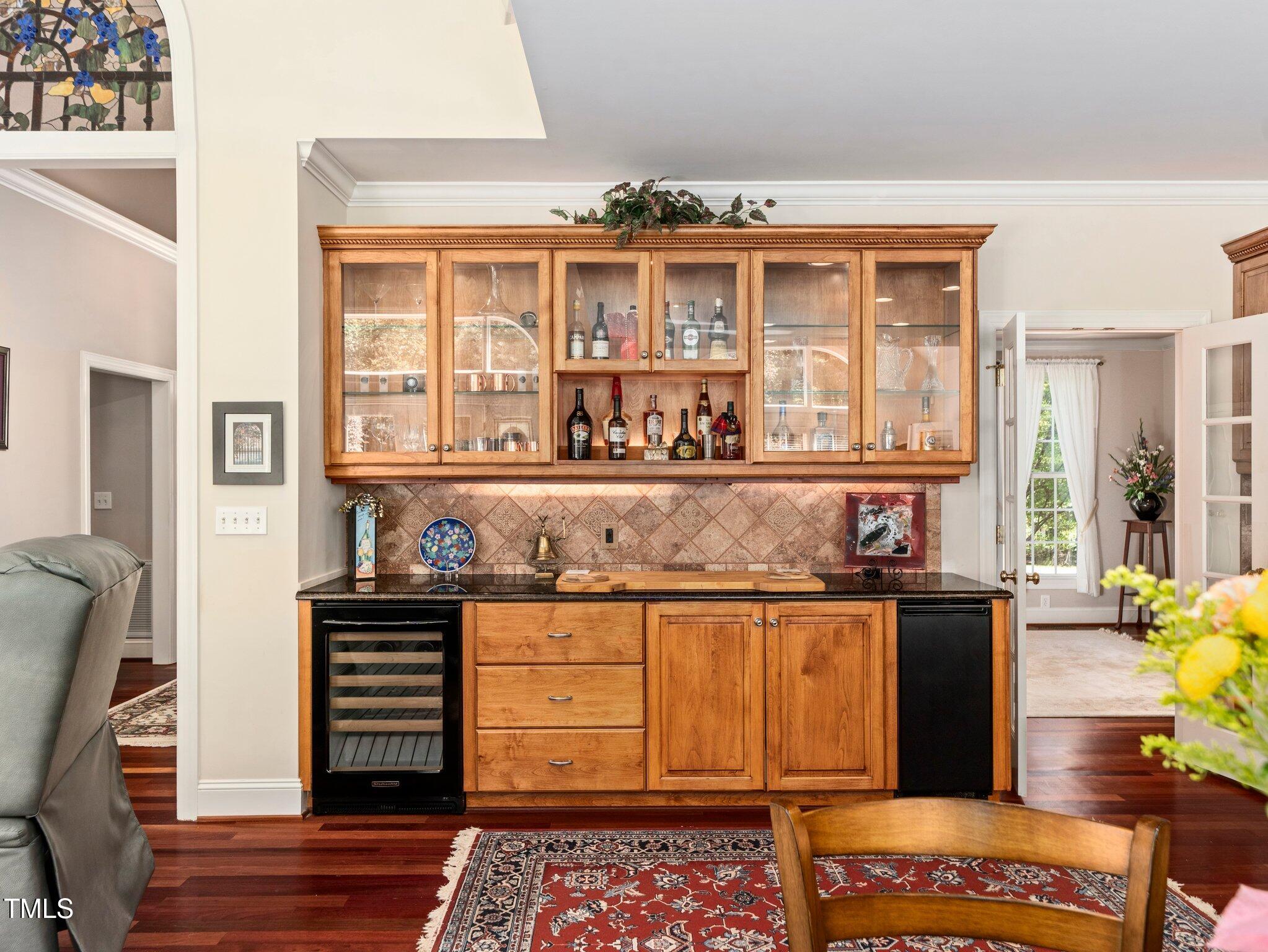 10937 Cahill Road Raleigh, NC 27614 - Photo 13 of 53 Stunning Entertainment Serving Bar w/Uline Ice Maker, Wine Cooler, Over, Under & Inside Cabinet Lighting for a Dramatic Touch.