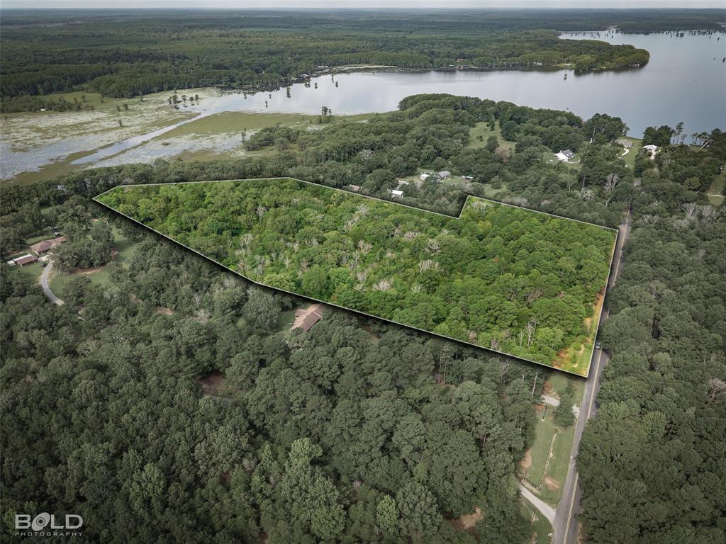11015 Hereford Road Mooringsport, LA 71060 - Photo 1 of 18 Expansive wooded acreage featuring mature trees and direct road frontage