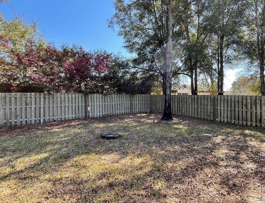 7491 Southwest 86th Way Gainesville, FL 32608 - Photo 15 of 15 a view of outdoor space with wooden fence