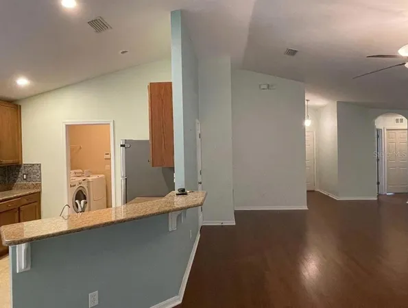 a view of a double vanity sink and a large mirror in a room