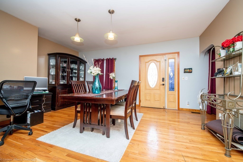 478 Third Street Fall River, MA 02721 - Photo 15 of 35 a dining room with furniture and wooden floor