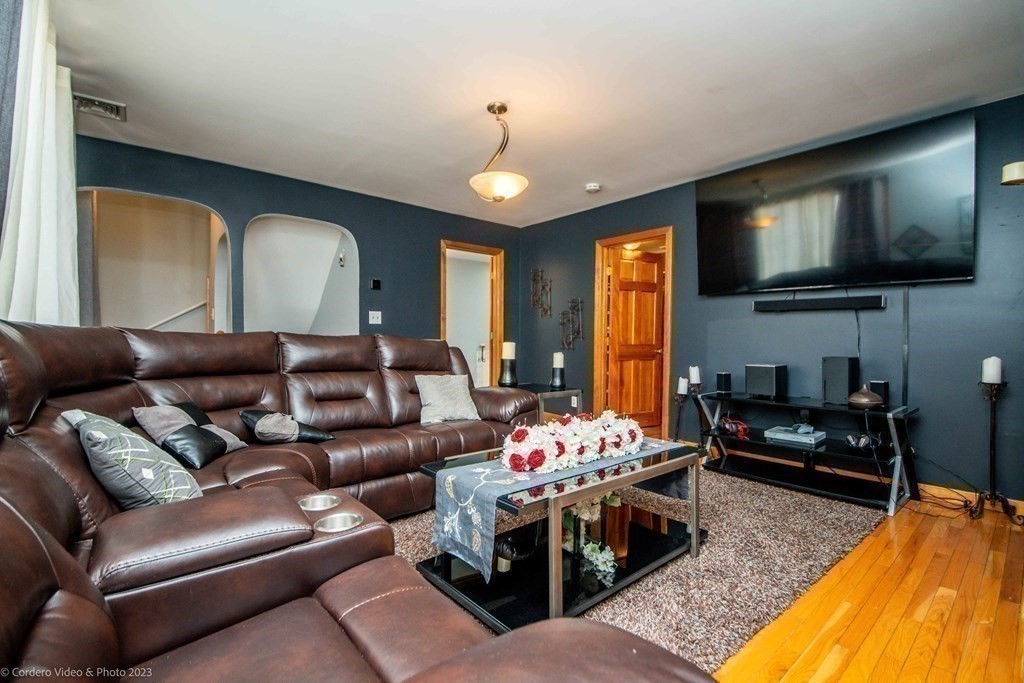 478 Third Street Fall River, MA 02721 - Photo 20 of 35 a living room with furniture and a flat screen tv